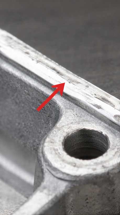 Burrs (excess material at parting lines/sliders)